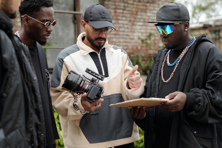 Reviewing Footage on Set with Group of Male Filmmakers